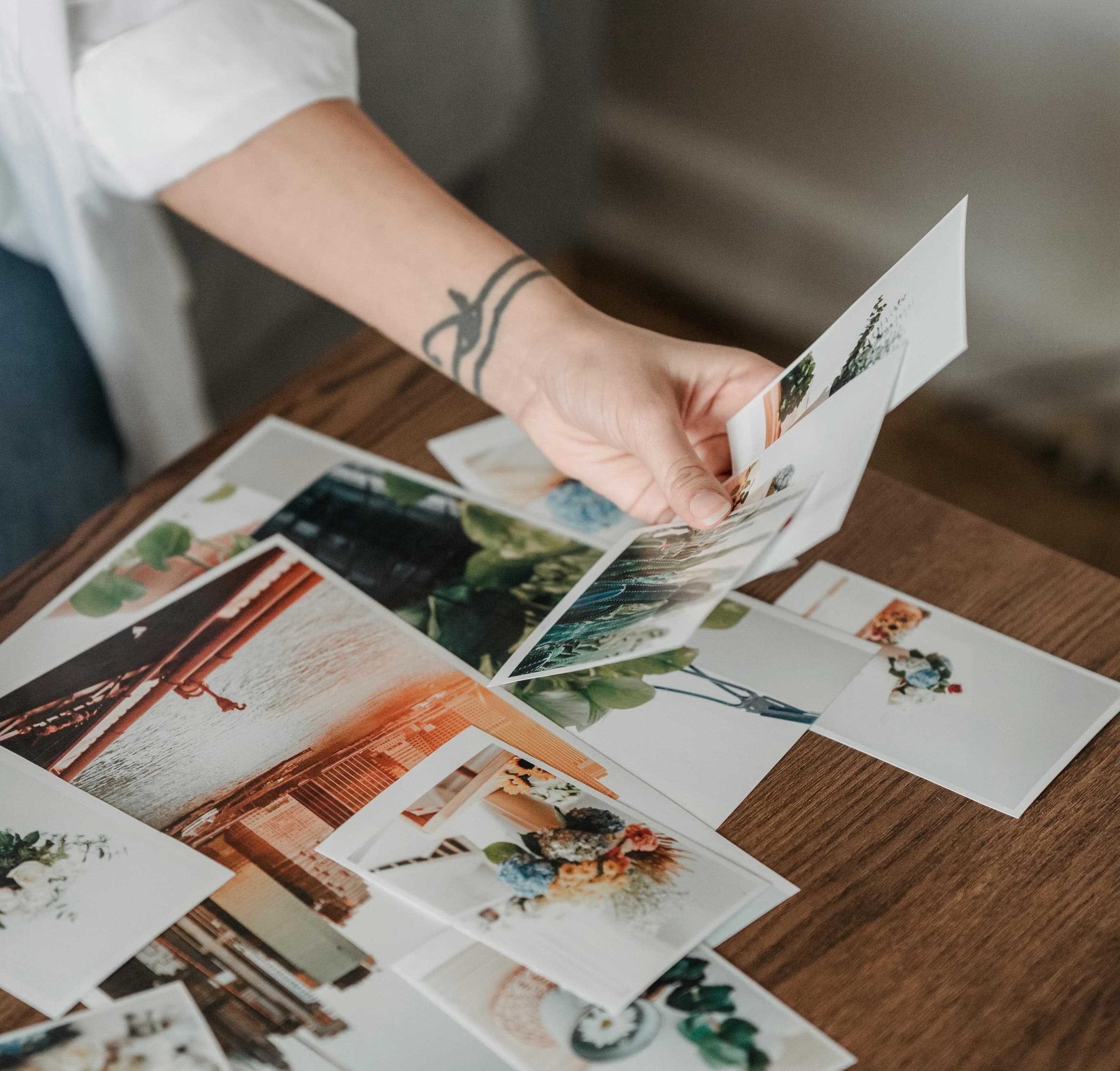 Person holding printed images